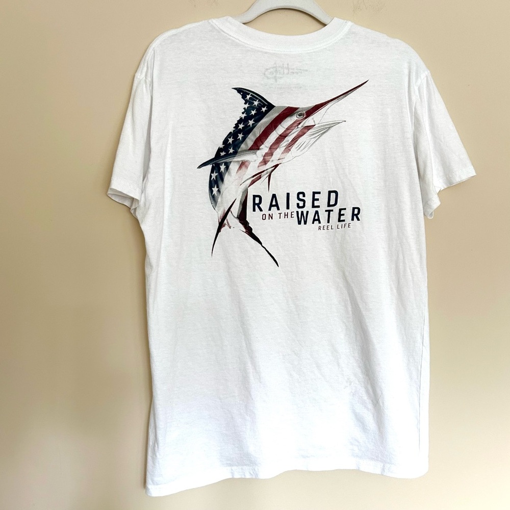 🔹Reel Life Men’s White Short Sleeve Graphic Tee Raised on the Water Marlin Flag